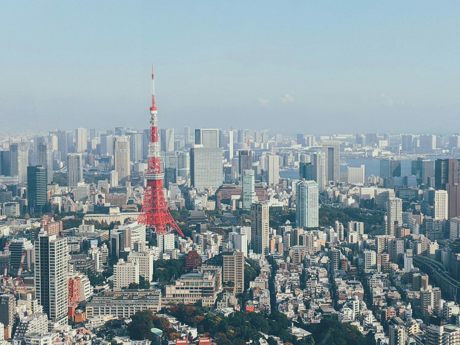Red And White Tower In The City During Daytime jigsaw puzzle preview