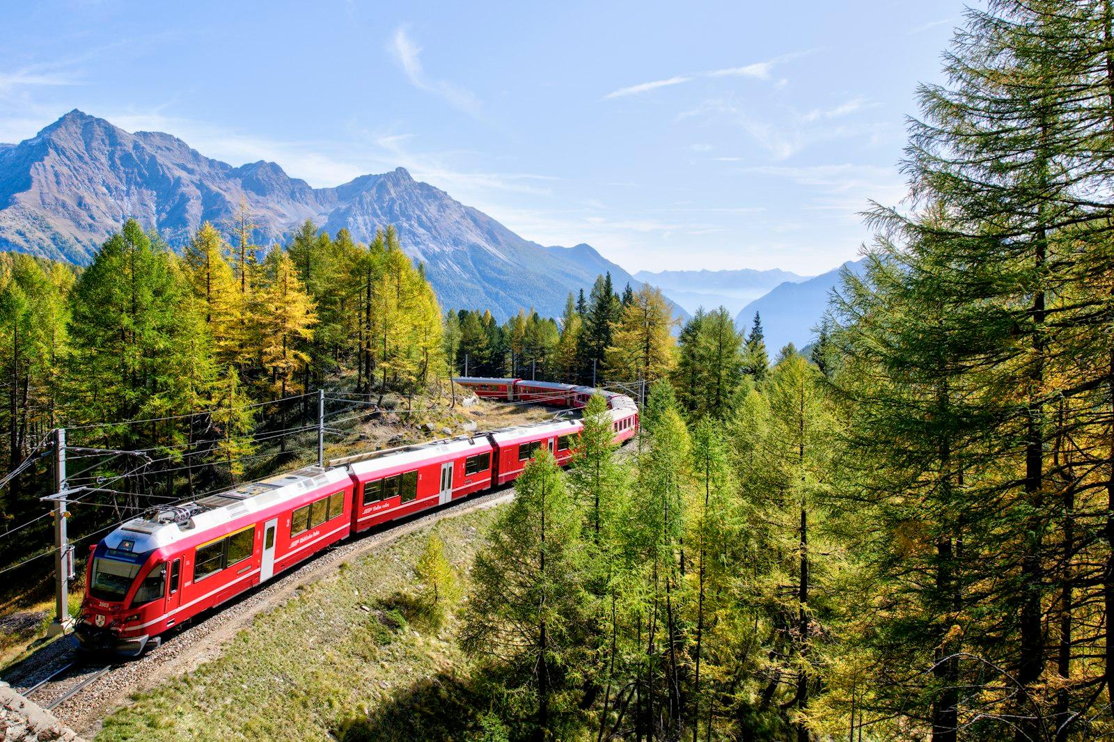 Red And White Train Near Trees During Daytime jigsaw puzzle preview