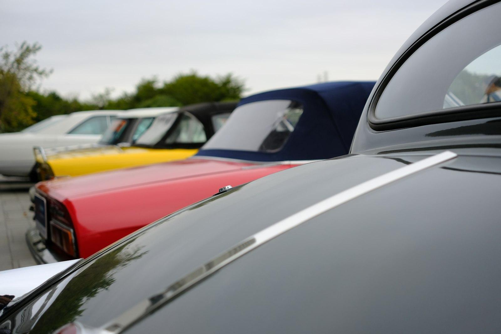 Row Of Vintage Cars With Colorful Hoods jigsaw puzzle preview