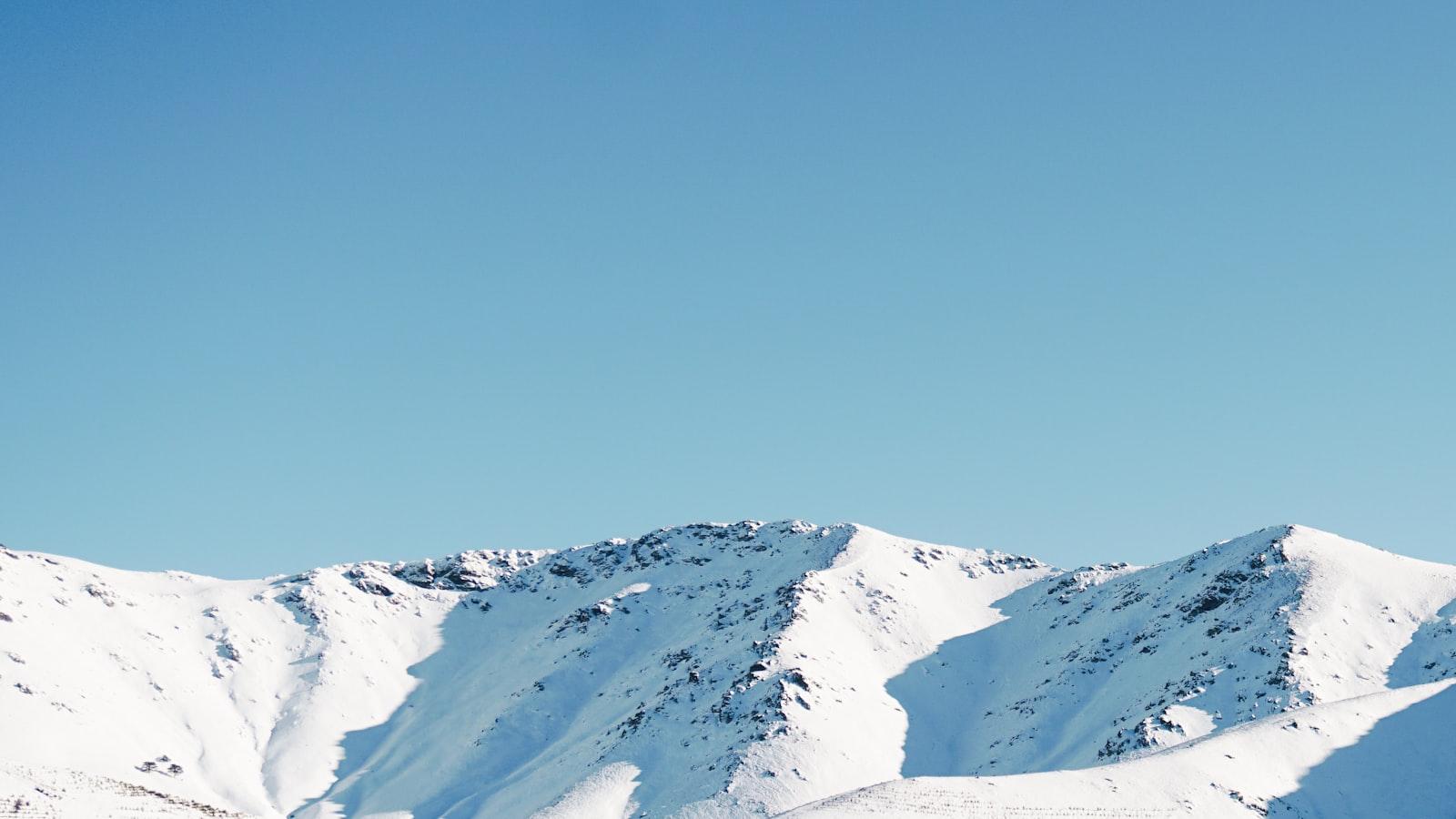 Snow Covered Mountain Under Blue Sky During Daytim jigsaw puzzle preview
