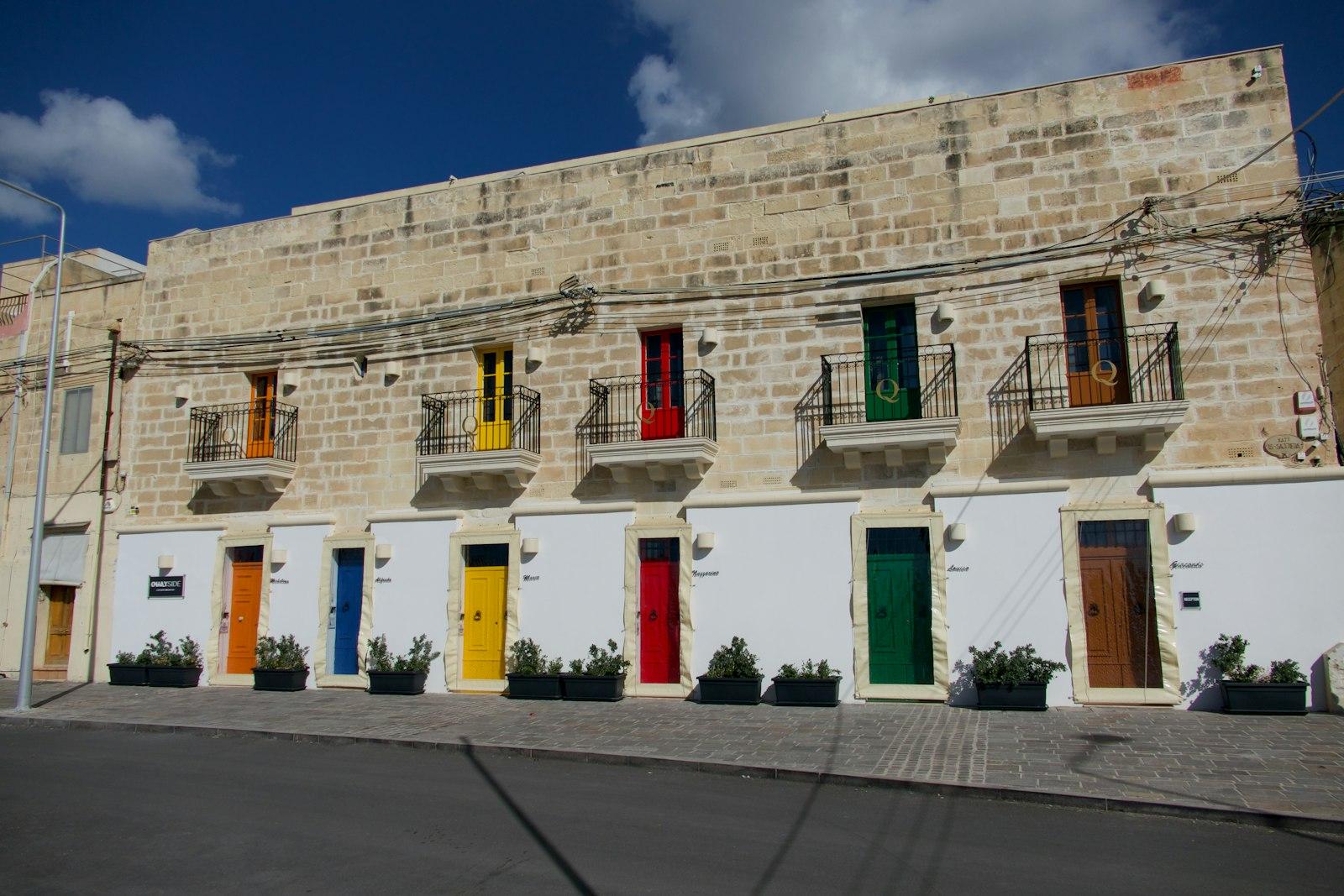 Stone Building With Colorful Doors And Balconies jigsaw puzzle preview