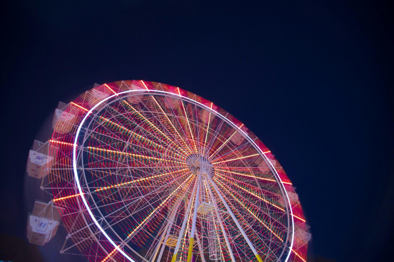 Timelapse Low Angle Of White And Red Ferris Wheel jigsaw puzzle preview