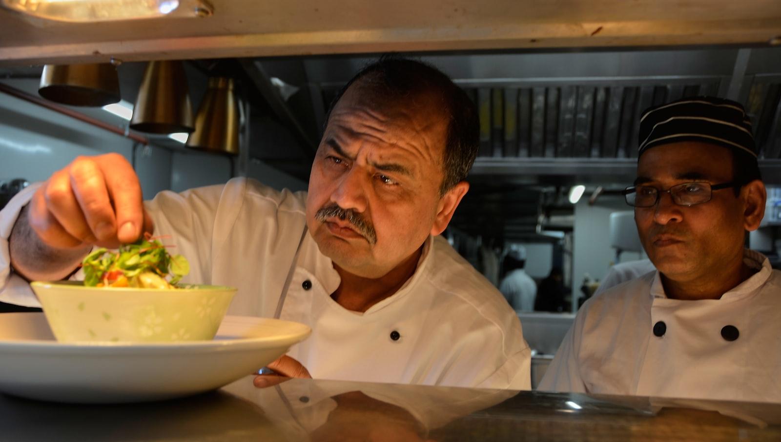 Two Chefs In A Kitchen Preparing A Meal jigsaw puzzle preview