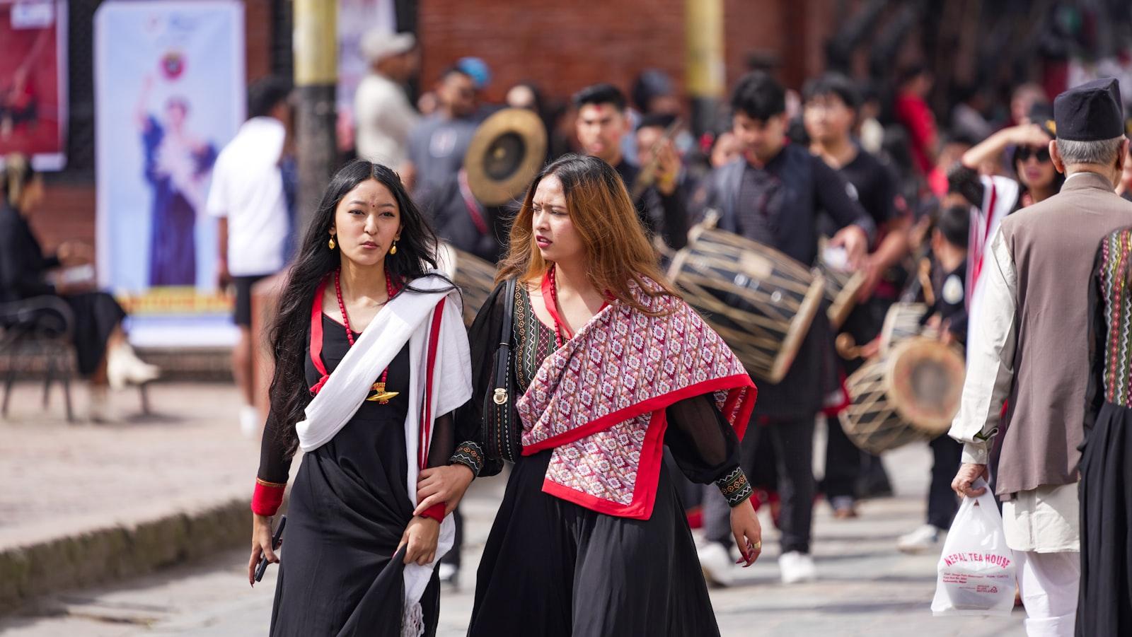 Two Women In Traditional Attire Walk In A Processi jigsaw puzzle preview