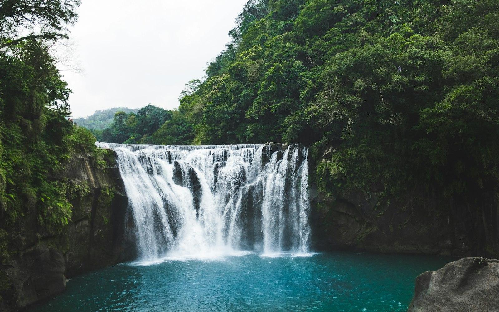 Waterfalls In The Middle Of Green Trees jigsaw puzzle preview