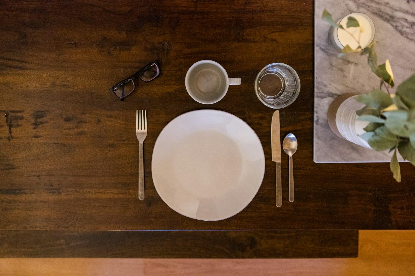 White Ceramic Plate On Brown Wooden Table jigsaw puzzle preview
