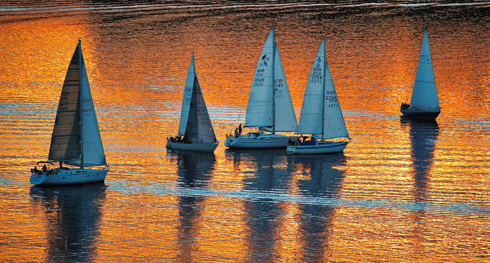 White Sail Boat On Body Of Water During Sunset jigsaw puzzle preview