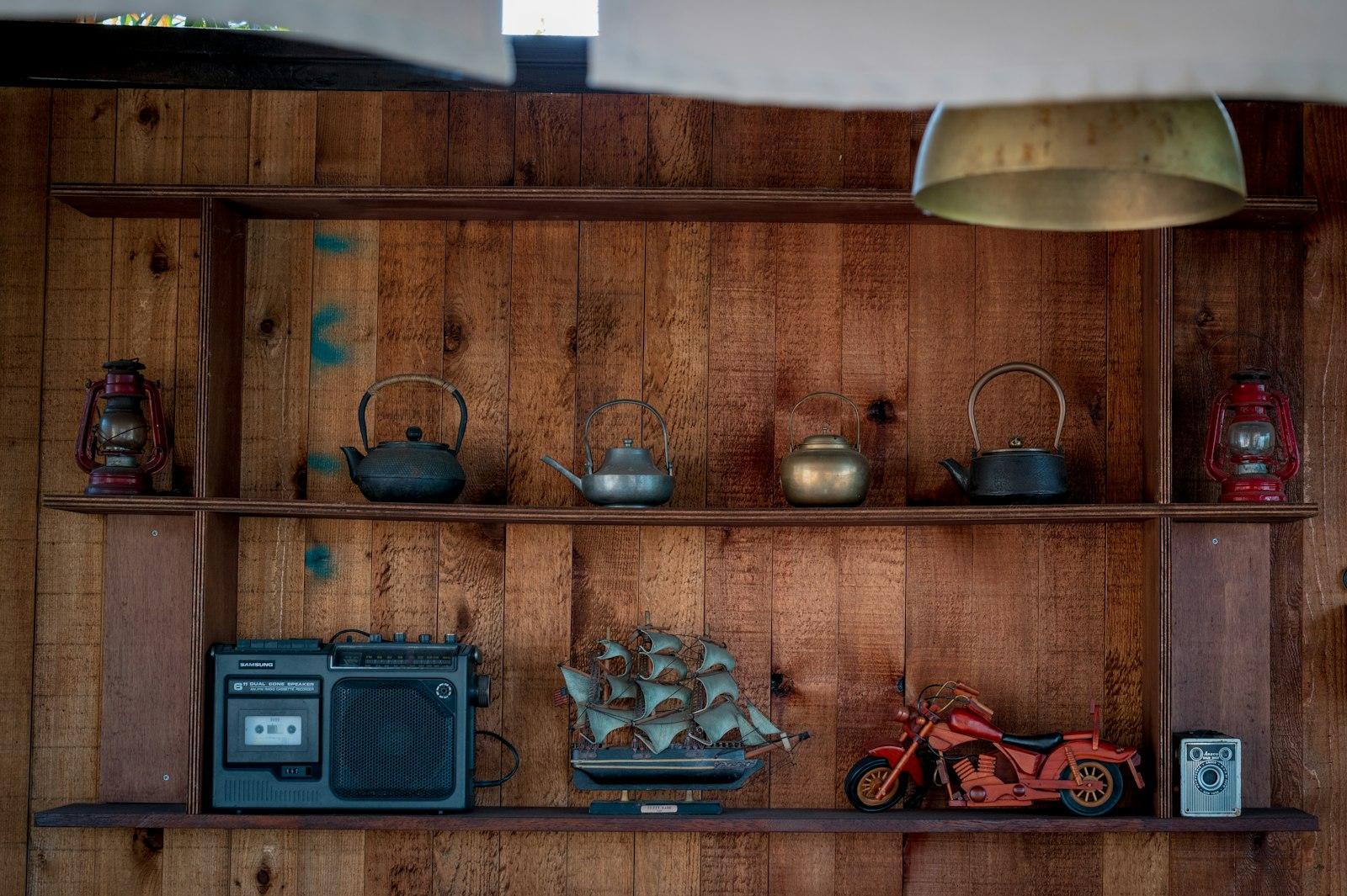 Wooden Shelves Display Teapots, Radio, And Motorcy jigsaw puzzle preview